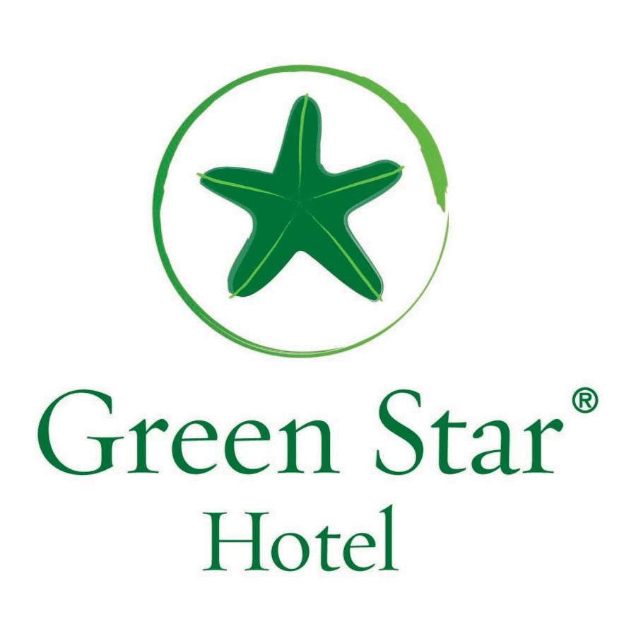 โรงแรมซาเฟอไคโร Giza ภายนอก รูปภาพ The image shows the logo of "Green Star Hotel." It features a green star, likely a stylized sea star, positioned above the text. The name "Green Star" is displayed prominently, with "Hotel" underneath it, all in a clean and simple font. The overall d